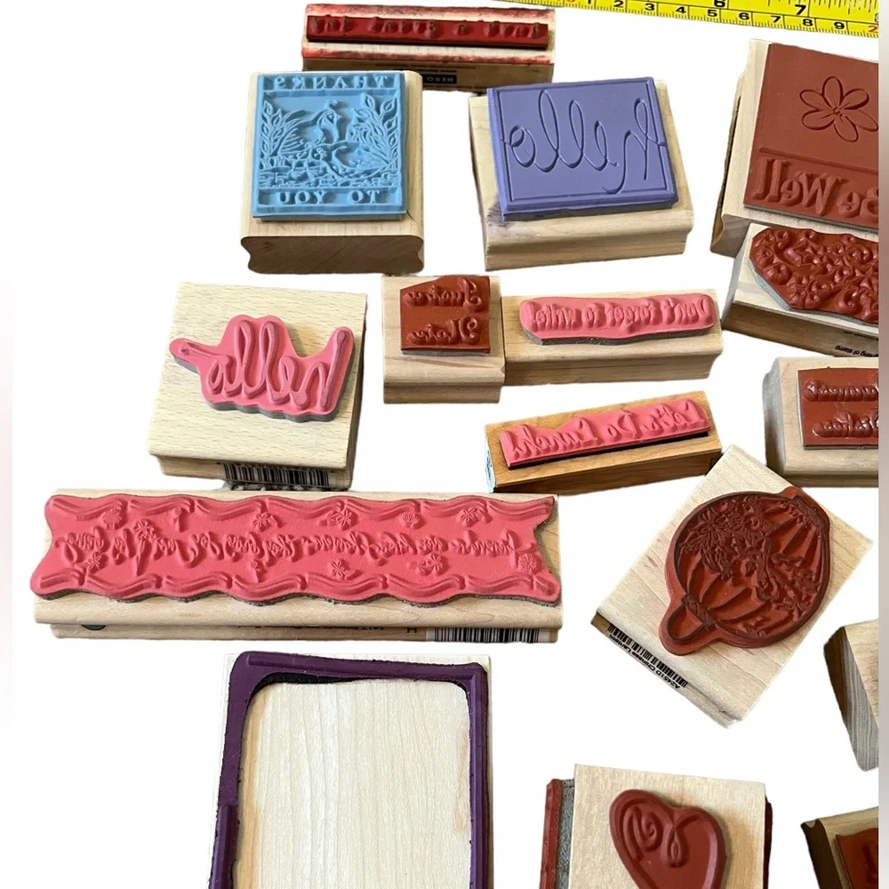 Lot of 20 rubber stamps. Most of the stamps are brand new.